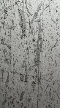 Abstract grey concrete wall texture with dark paint splatters and grunge . Stock Photos