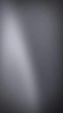 Abstract grey gradient vertical background with a grainy texture and soft l.. Stock Photos