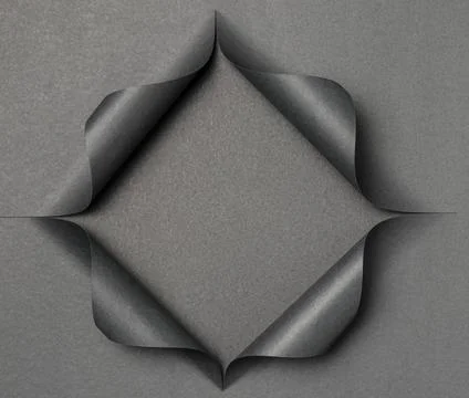 Abstract grey shape on torn black paper Stock Photos