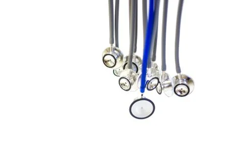 Abstract of a group of gray stethoscopes and one blue stethoscope Fotos Stock