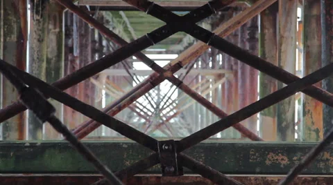 Abstract Grunge Close Up Through Rusty Pillar Supports of Metal Teignmouth Pier 動画素材 46510004
