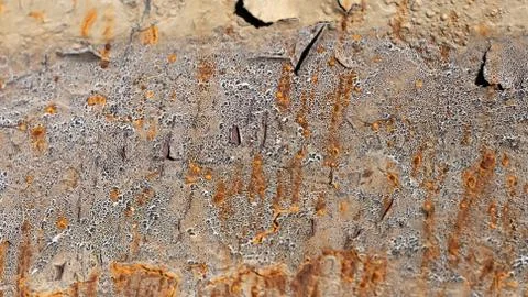 Abstract grunge cracking texture with paint flaking on rusty metal background Stock Photos