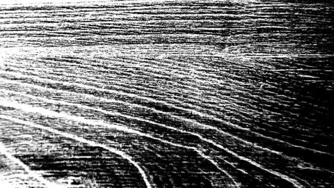 Abstract grunge texture with distorted lines on black background. Illustrazione stock