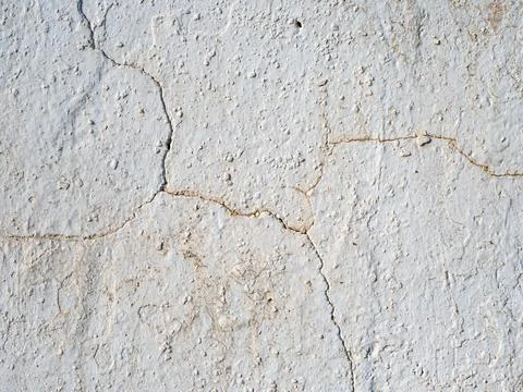 Abstract grunge texture of a rough old wall with cracks on it Stock Photos