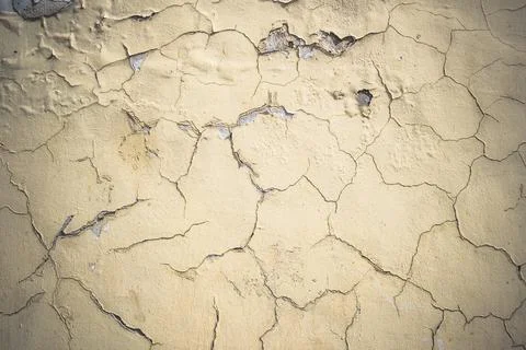 Abstract grunge wall background. Old plastered wall with many cracks. Grungy Stock Photos