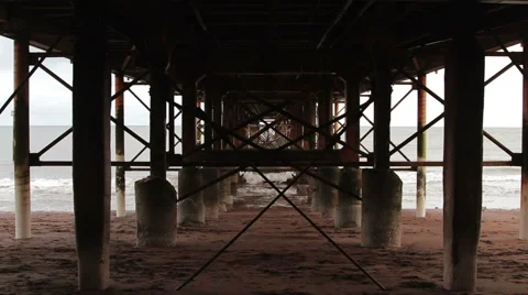 Abstract Grunge Wide Shot Through Rusty Pillar Supports of Pier Metal Structure Stock-Footage 46510109