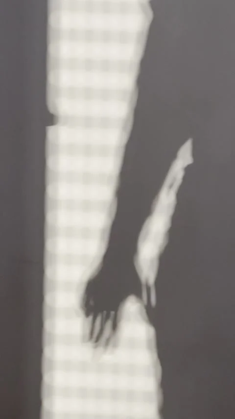 Abstract Hand Shadow Moving Fingers on Wall Vertical Background Stock Footage 339553575