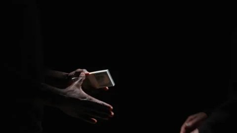 Abstract Hands Exchange a Stack of 100 Dollar Bills and Shake Hands in Darkness Stock Footage 208799420