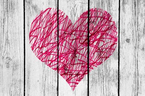 Abstract heart with messy pattern on old wooden wall 写真素材
