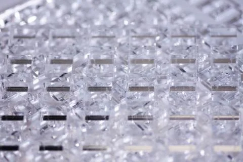 Abstract high-tech background. Details of transparent plastic or glass. Laser Stock Photos