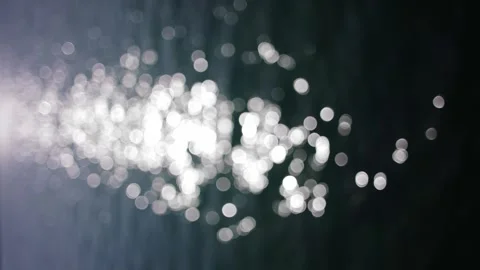 Abstract highlights bokeh from waves. Ripples, sun glare, circles on waves water Stock Footage 240687970