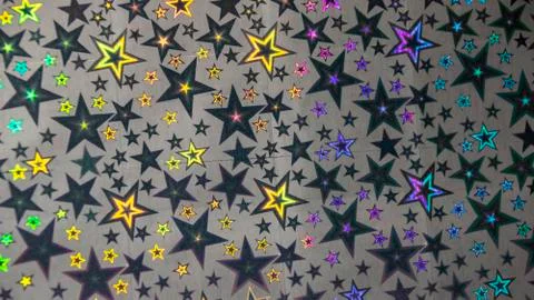 Abstract holiday background five pointed stars multicolor glow iridescence pa Stock Photos