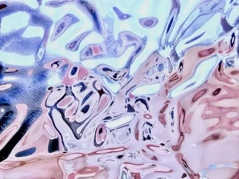 Abstract holographic chrome texture with distorted metallic ripple effect and Stock-Fotos