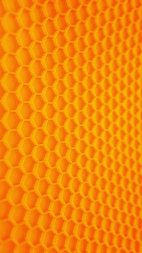 Abstract honeycomb with glowing orange texture and vertical motion Stock Footage 344969834