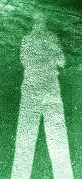 Abstract Human Shadow on Forest Green Textured Road Stock Photos