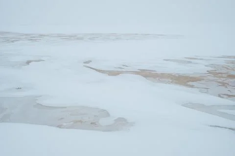 Abstract ice patterns on a frozen river Stock Photos