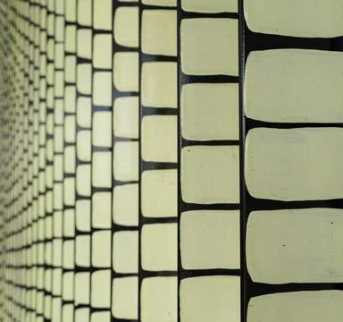 Abstract Illuminated Architectural Wall Pattern with Repeating Geometric Desi Stock Photos