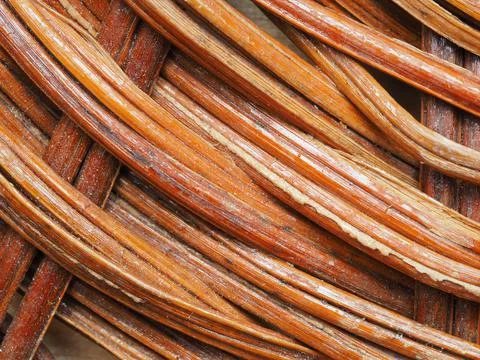 Abstract image, background, texture, closeup. wicker basket. curved orange an Stock Photos