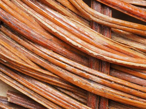 Abstract image, background, texture, closeup. wicker basket. curved orange an Stock Photos