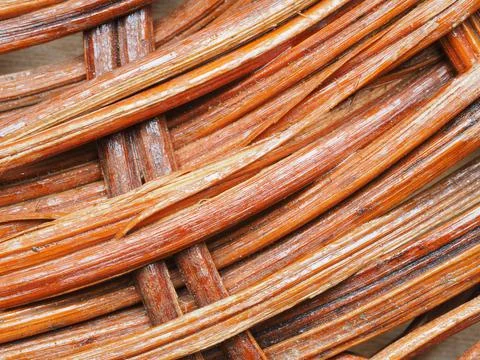 Abstract image, background, texture, closeup. wicker basket. curved orange an Stock Photos