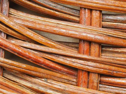 Abstract image, background, texture, closeup. wicker basket. curved orange an Stock Photos