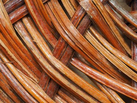 Abstract image, background, texture, closeup. wicker basket. curved orange an Stock Photos