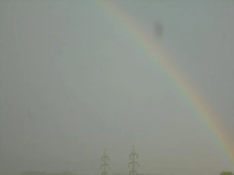 Abstract image of beautiful rainbow on a sparse cloud after strom Stock Photos