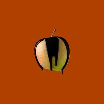 Abstract image of black paint dripping on fruit Stock Photos