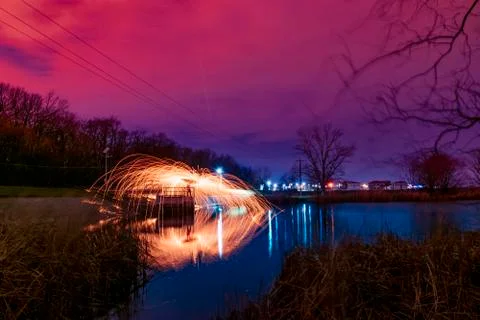 Abstract Image of Burning Wirewool being used to make circle like light trail Stock Photos