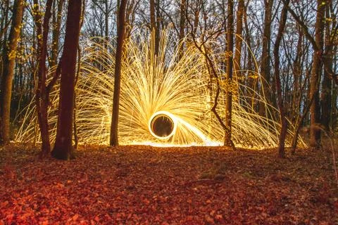 Abstract Image of Burning Wirewool being used to make circle like light trail Stock Photos