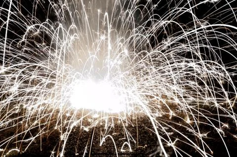 Abstract image of an exploding firework in the night 库存照片