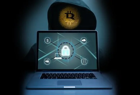 The abstract image of the hacker, laptop, bitcoin. the concept of cyber attack 库存照片
