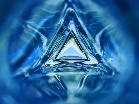 Abstract image of the inside of a triangle glass bottle blue color background 스톡 사진
