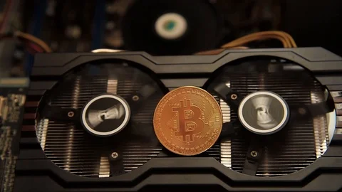 An abstract image of the mining Bitcoin with a computer graphics card fan Stock Footage 86102520