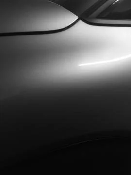 Abstract image of modern car side with smooth shiny surfaces in black and whi Stock Photos