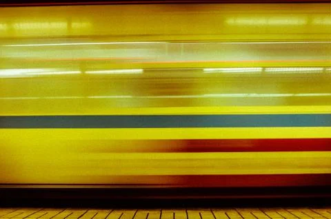 Abstract image of moving train passing through a station Stock Photos