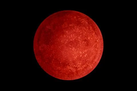 Abstract image of planet Mars from the surface of an old griddle on a black b Stock Photos