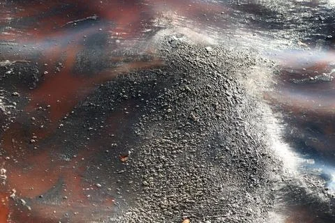 Abstract Image of Polluted Water Surface with Oily Patterns Stock Photos
