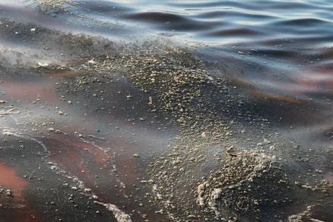 Abstract Image of Polluted Water Surface with Oily Patterns Stock Photos