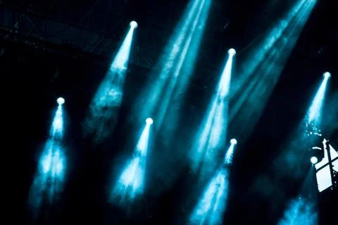 Abstract image with rays of colored light in the dark Stock Photos