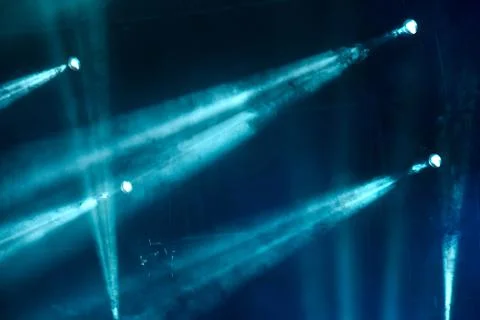 Abstract image with rays of colored light in the dark Stock Photos