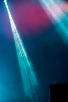 Abstract image with rays of colored light in the dark Stock Photos