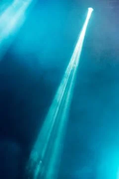 Abstract image with rays of colored light in the dark Stock Photos