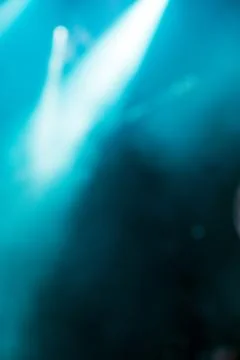 Abstract image with rays of colored light in the dark Stock Photos