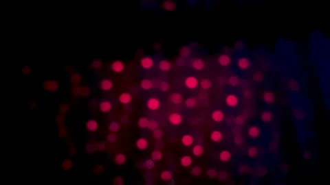 Abstract image of red bokeh lights against a dark background creating a mys.. Stock Footage 340052514