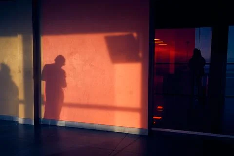An abstract image from the shadow of a man. Their human outlines can be seen on Fotos de archivo
