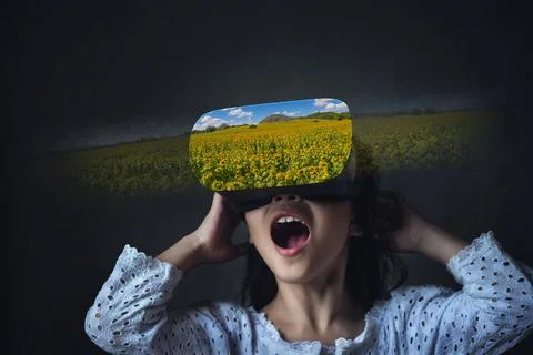 Abstract image of virtual reality experience, a girl in VR glasses Stock Photos