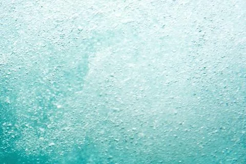 An abstract image of water bubbles in a turquoise hue Stock Photos