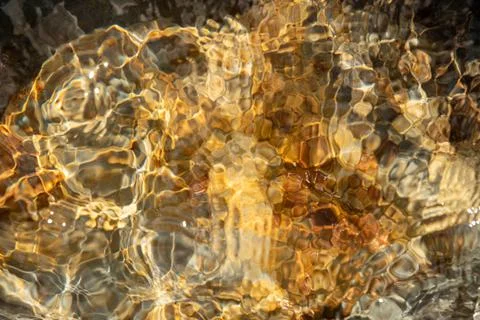 Abstract image of the water surface. Rusty orange color. Stock Photos