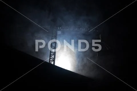 Abstract Industrial background with construction crane silhouette over amazin Stock Photos